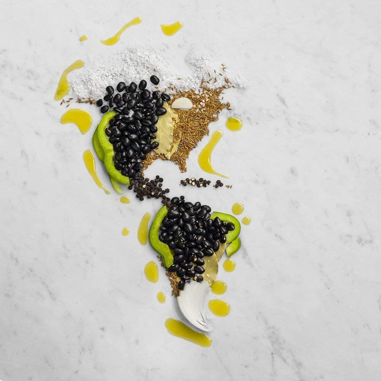 Load image into Gallery viewer, A map of North, Central, and South America covered in black beans, avocado, rice, and peppers.