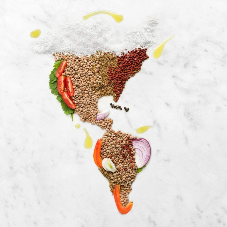 Load image into Gallery viewer, A map of South America, Central America, and North America covered in Peruvian Lentils Sofrito with peppers, tomatos, and onion. 
