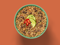 Load image into Gallery viewer, A delicious bowl of Fillo&#39;s Puerto Rican Rice &amp; Gandules Sofrito topped with tomato and lime.
