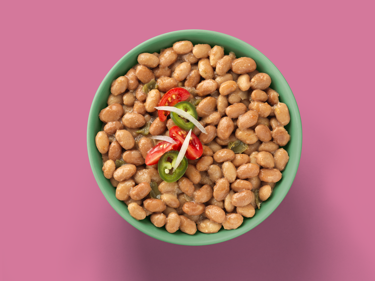 Load image into Gallery viewer, A bowl of Fillos Todos Los Beans with tomatos and jalapeno. 
