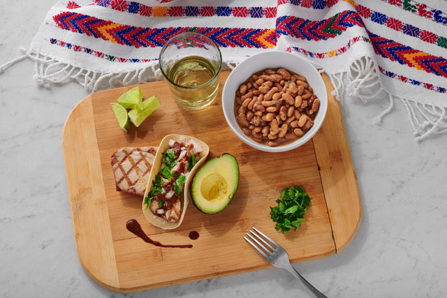 Load image into Gallery viewer, A dinner spread with Fillo&#39;s Mexican Mayocoba Sofrito, tacos, avocado, and more. 
