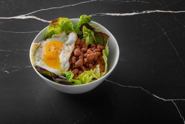 Load image into Gallery viewer, A bowl of Puerto Rican Pink Beans Sofrito. topped with a fried egg
